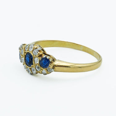 Victorian 18 Karat Royal Blue Sapphire and Diamond Three Stone Cluster Ring