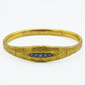 Art Nouveau Engraved 1907 18 Karat Yellow Gold Bangle With Sapphires